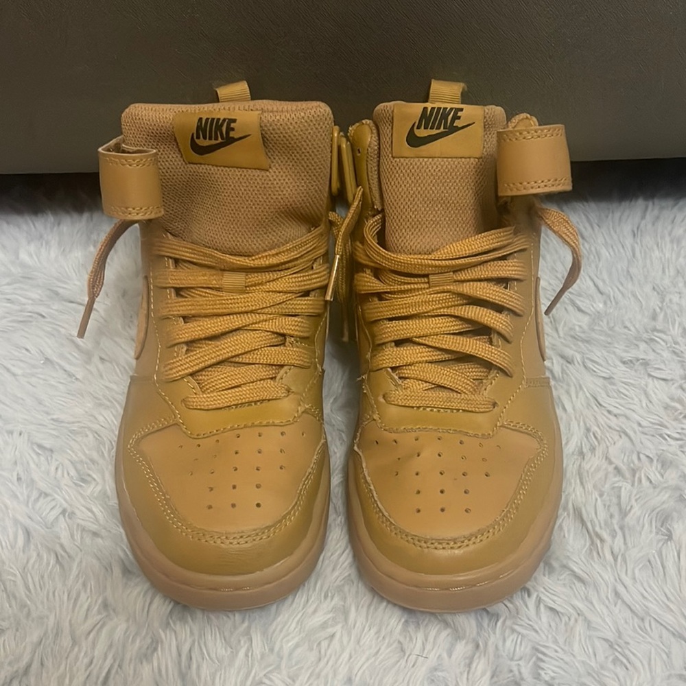 Size 4.5Y high top nike with strap, no sole on the inside of the sneakers